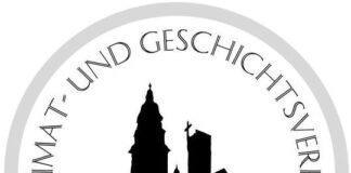 Das Wappen der Stadt Münster bei DIeburg vor einem Schattenriss